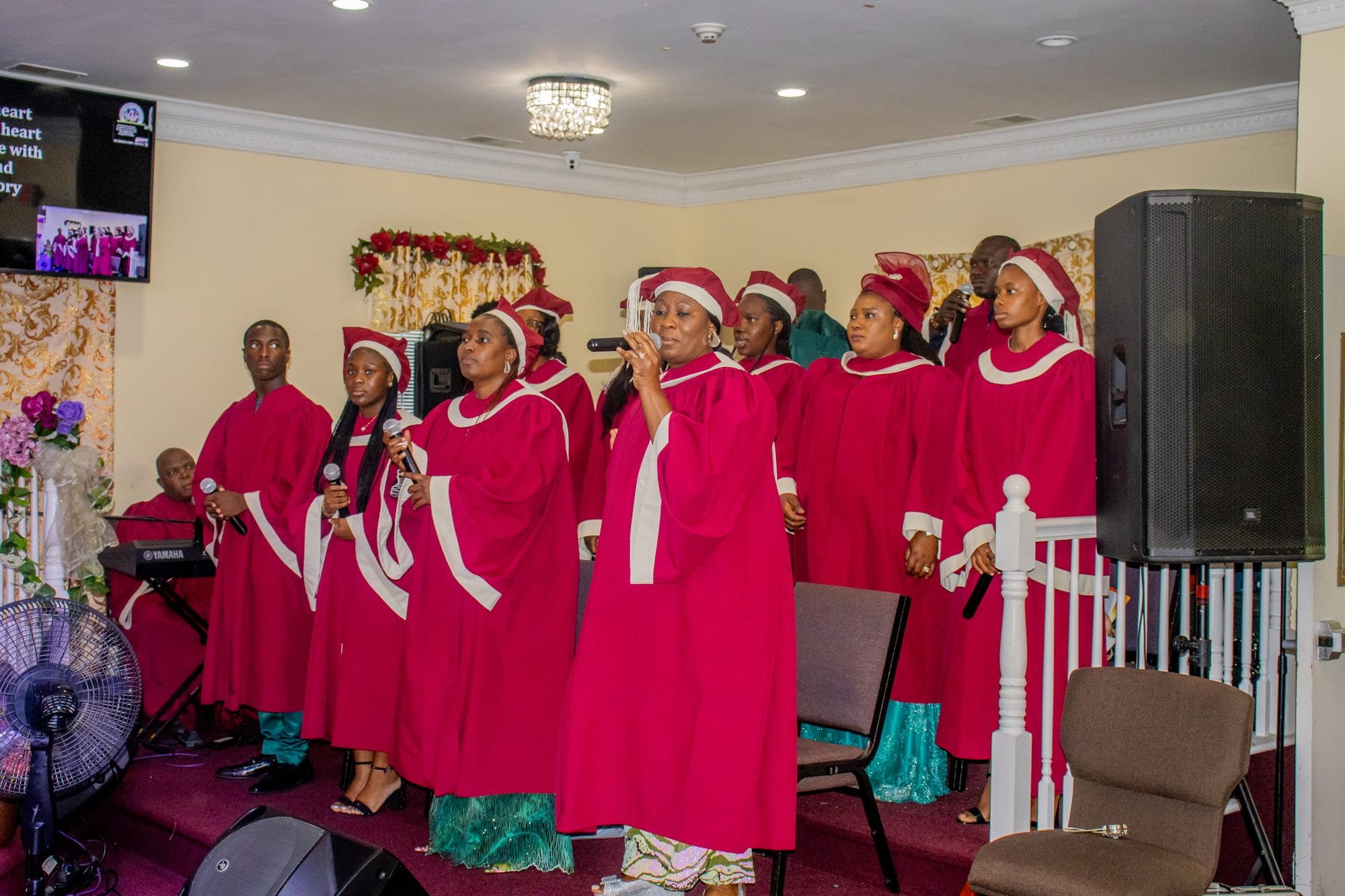 The choir in red and white robes